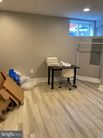 a bedroom with a bed and a table