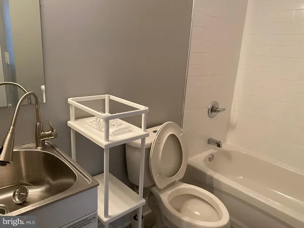 a room with a large bed and a table