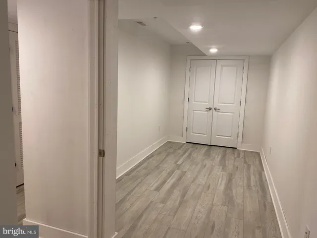 a view of a livingroom with wooden floor