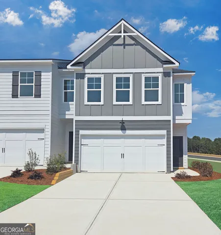 a front view of a house with yard
