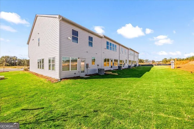 a view of house with yard