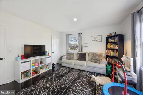 a living room with furniture and a rug