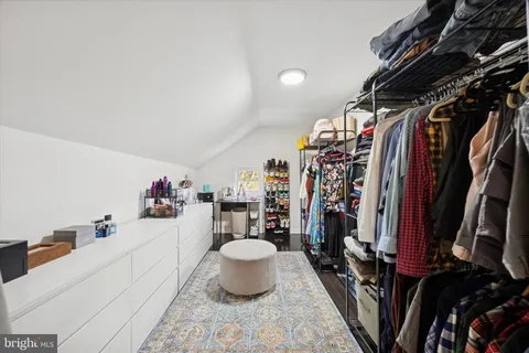 a bedroom with a bed and furniture