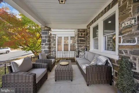 a outdoor living space with patio furniture and a potted plant