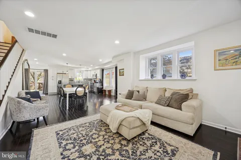 a living room with furniture and a rug