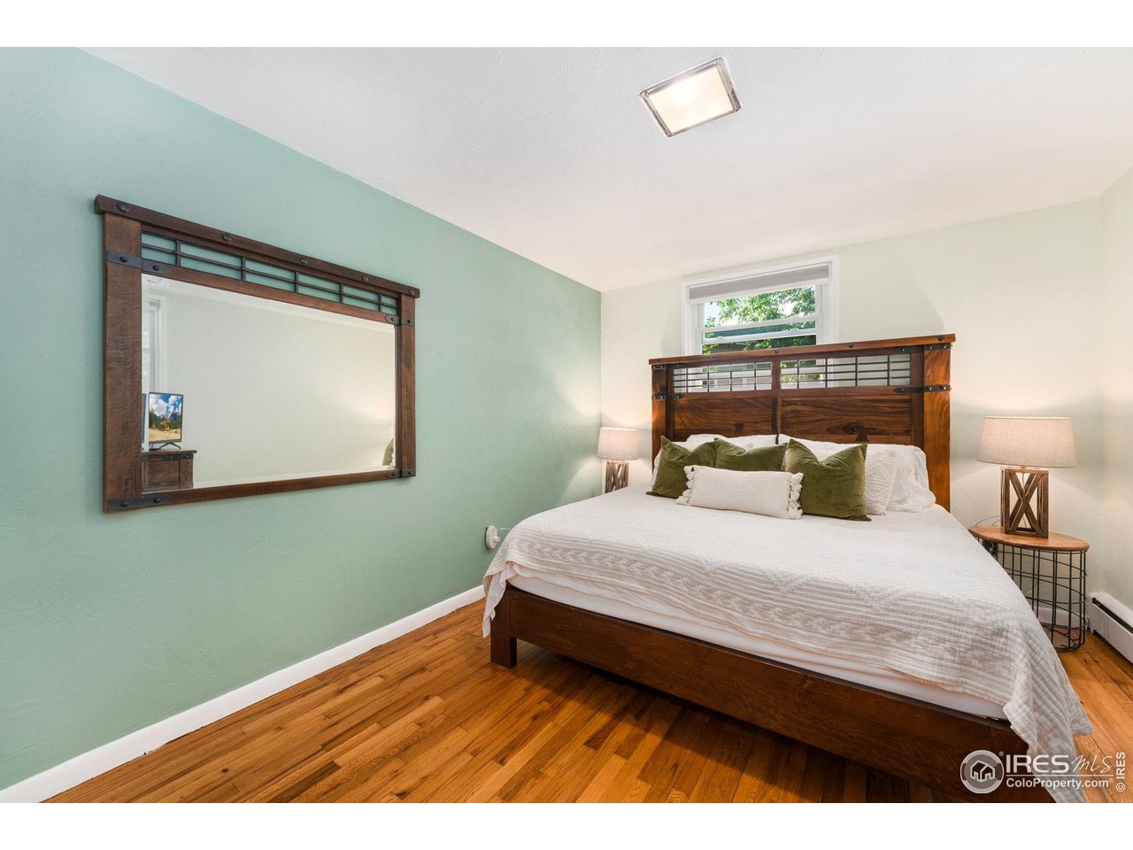 7908 Stuart Place Westminster, CO 80030 - Photo 16 of 30 a bedroom with a bed and window