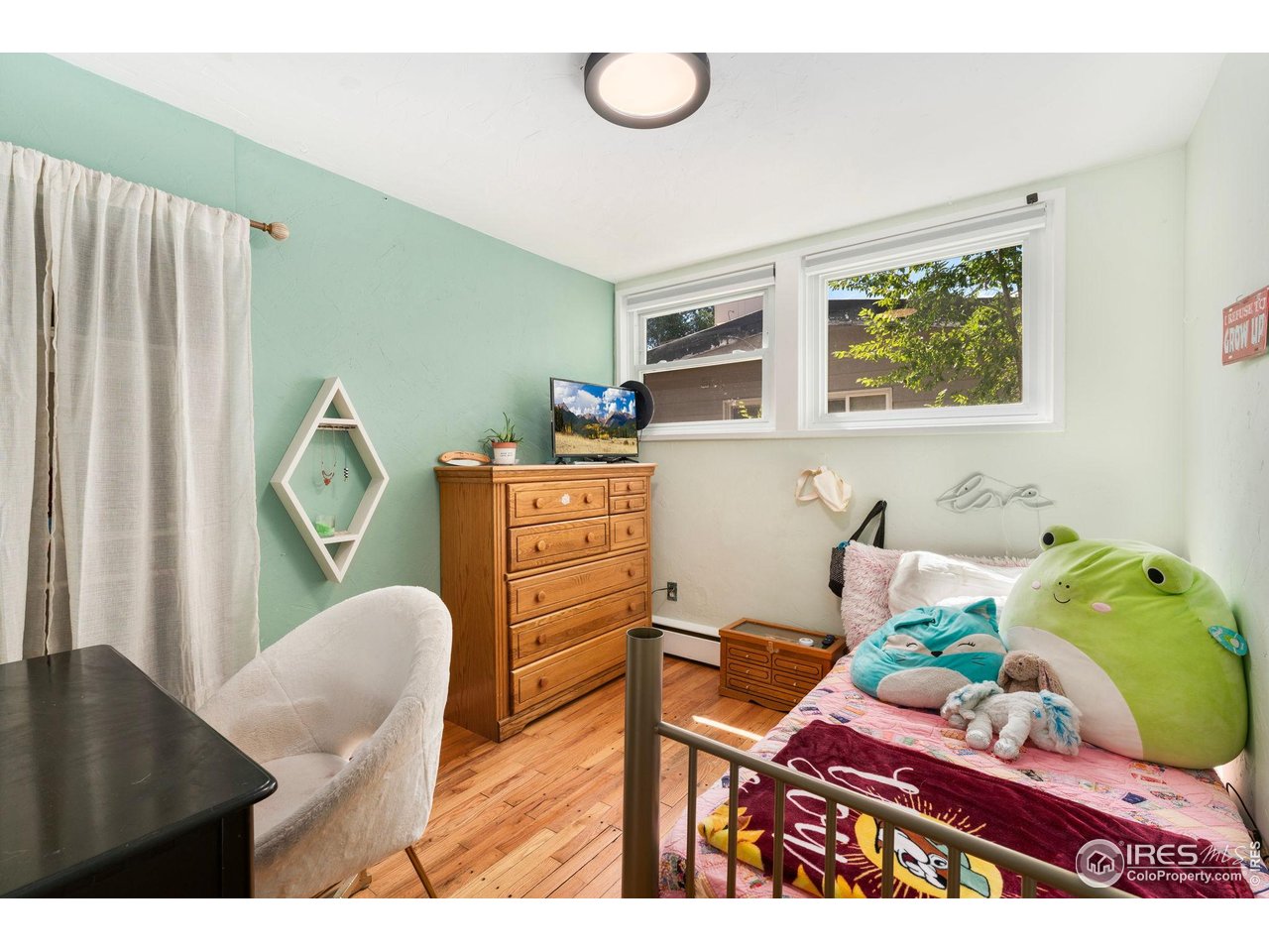 7908 Stuart Place Westminster, CO 80030 - Photo 20 of 30 a living room with furniture and a window