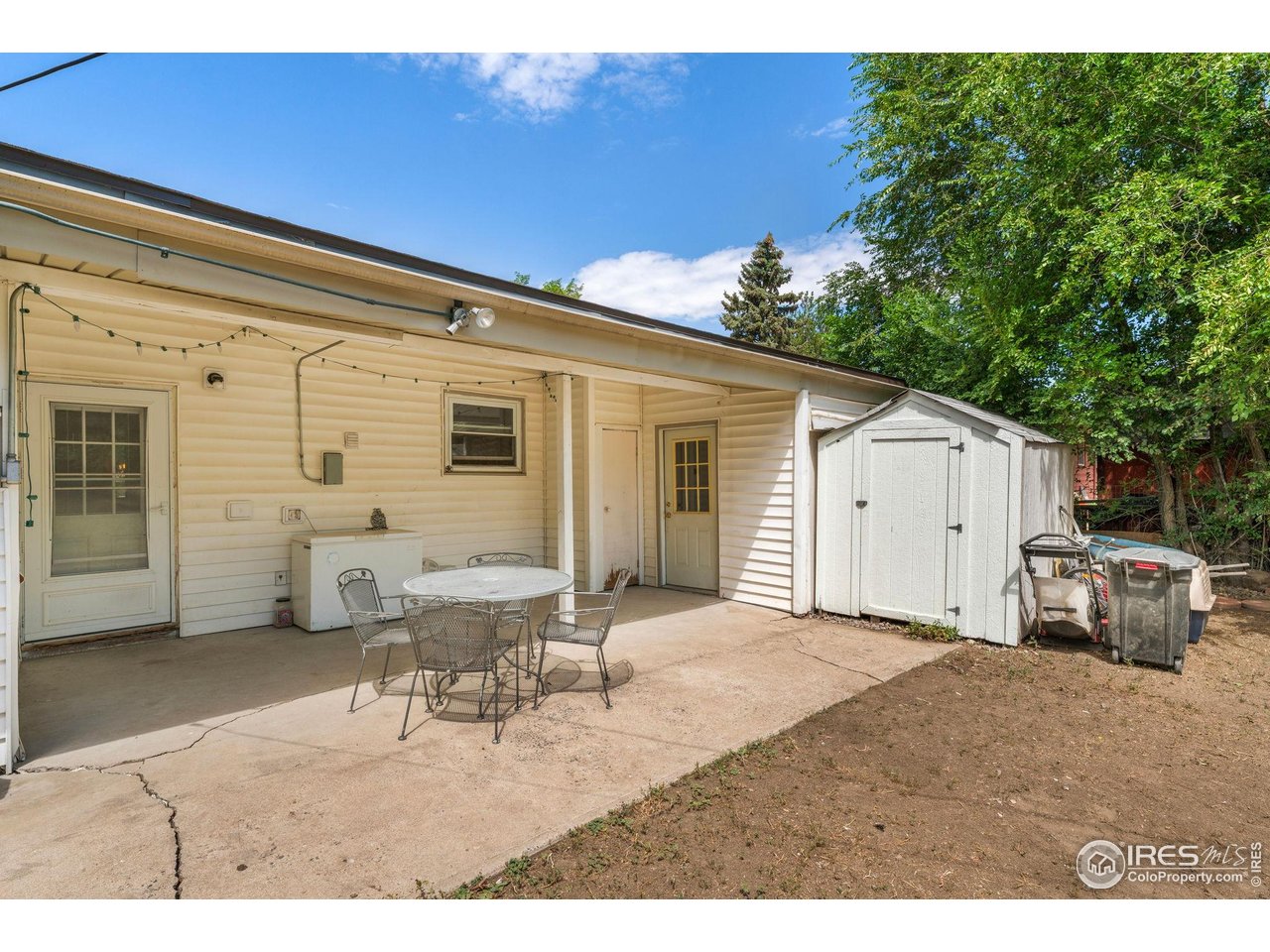7908 Stuart Place Westminster, CO 80030 - Photo 25 of 30 a view of a white house and a small yard