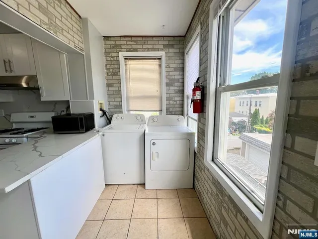a kitchen with a stove a sink and a refrigerator
