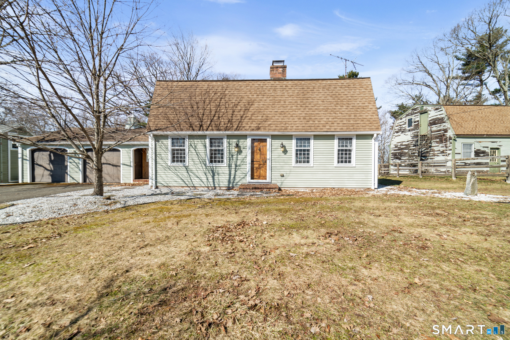 front view of a house with a yard