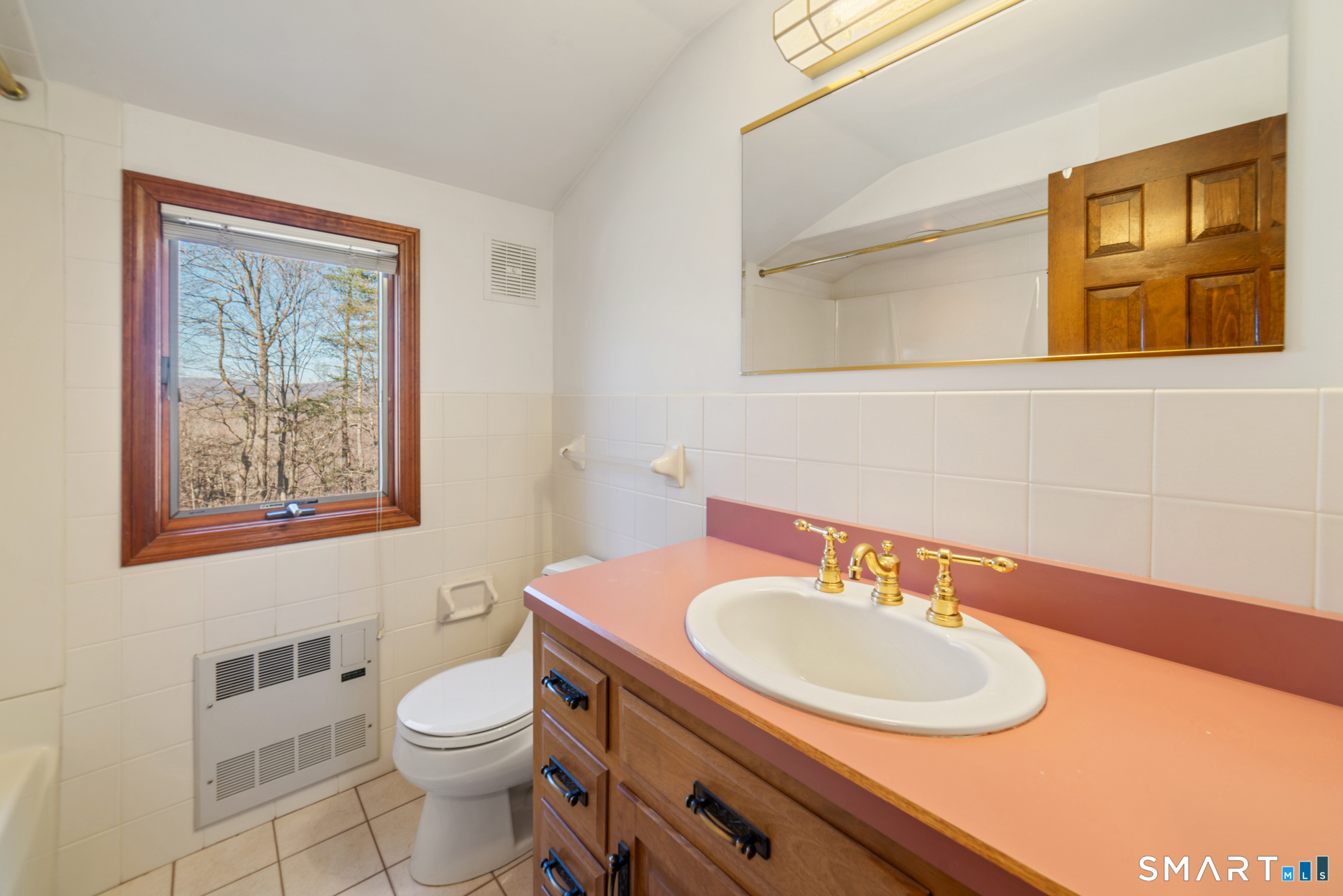 91 Gleeson Road Middletown, CT 06457 - Photo 25 of 39 a bathroom with a sink a toilet and mirror