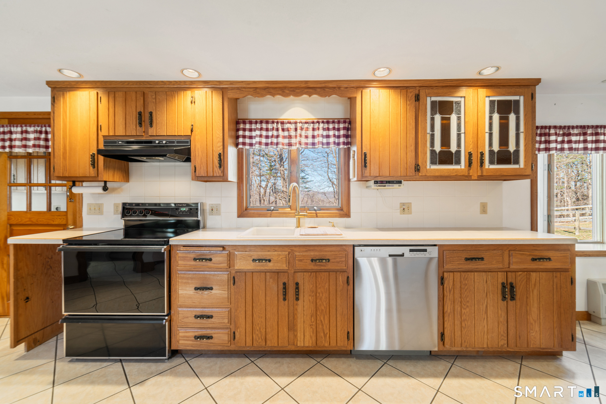 91 Gleeson Road Middletown, CT 06457 - Photo 5 of 39 a kitchen with stainless steel appliances granite countertop a stove and a refrigerator