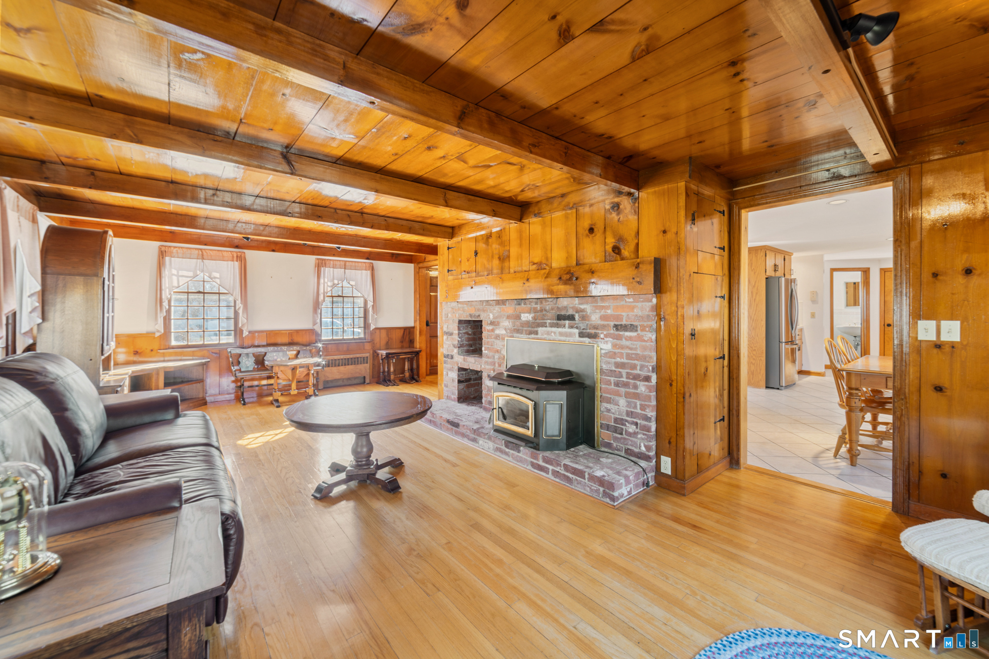91 Gleeson Road Middletown, CT 06457 - Photo 7 of 39 a living room with furniture a fireplace and wooden floor