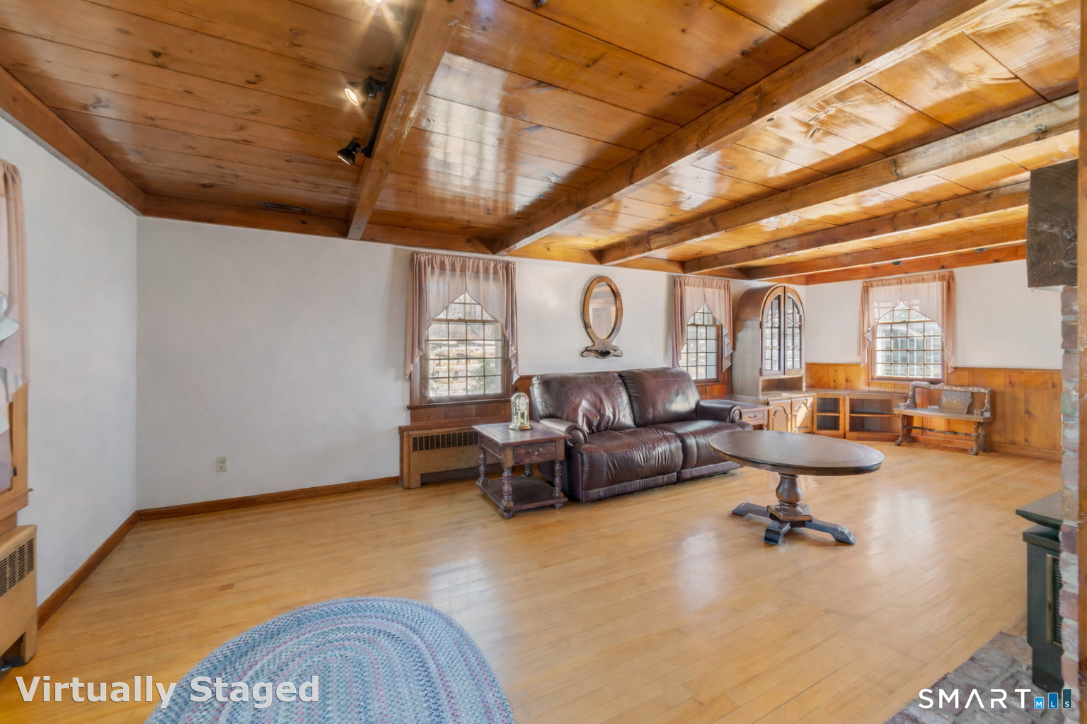 91 Gleeson Road Middletown, CT 06457 - Photo 9 of 39 a living room with fireplace furniture and a large window