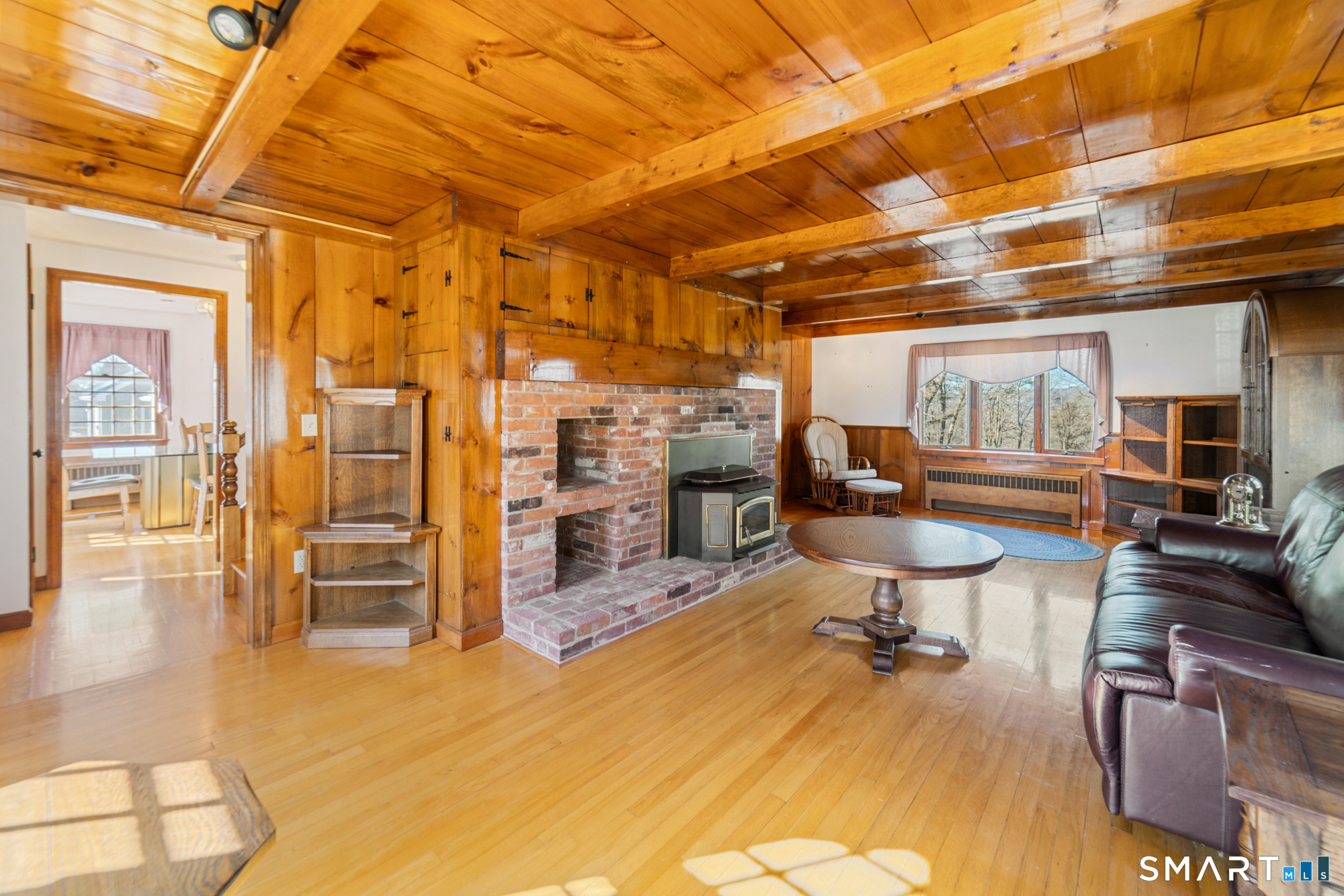 91 Gleeson Road Middletown, CT 06457 - Photo 10 of 39 a view of a livingroom with furniture a chandelier and wooden floor