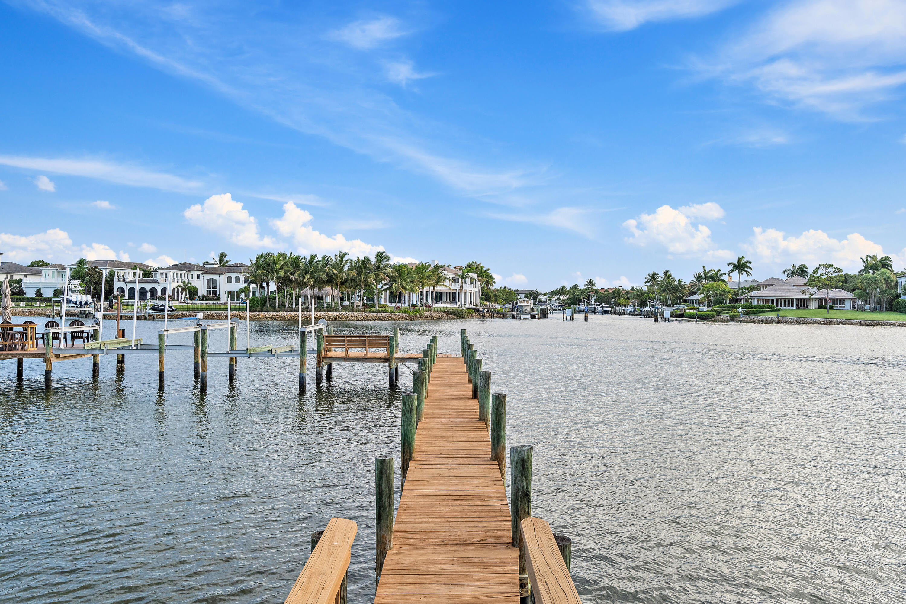 a lake view with a big yard