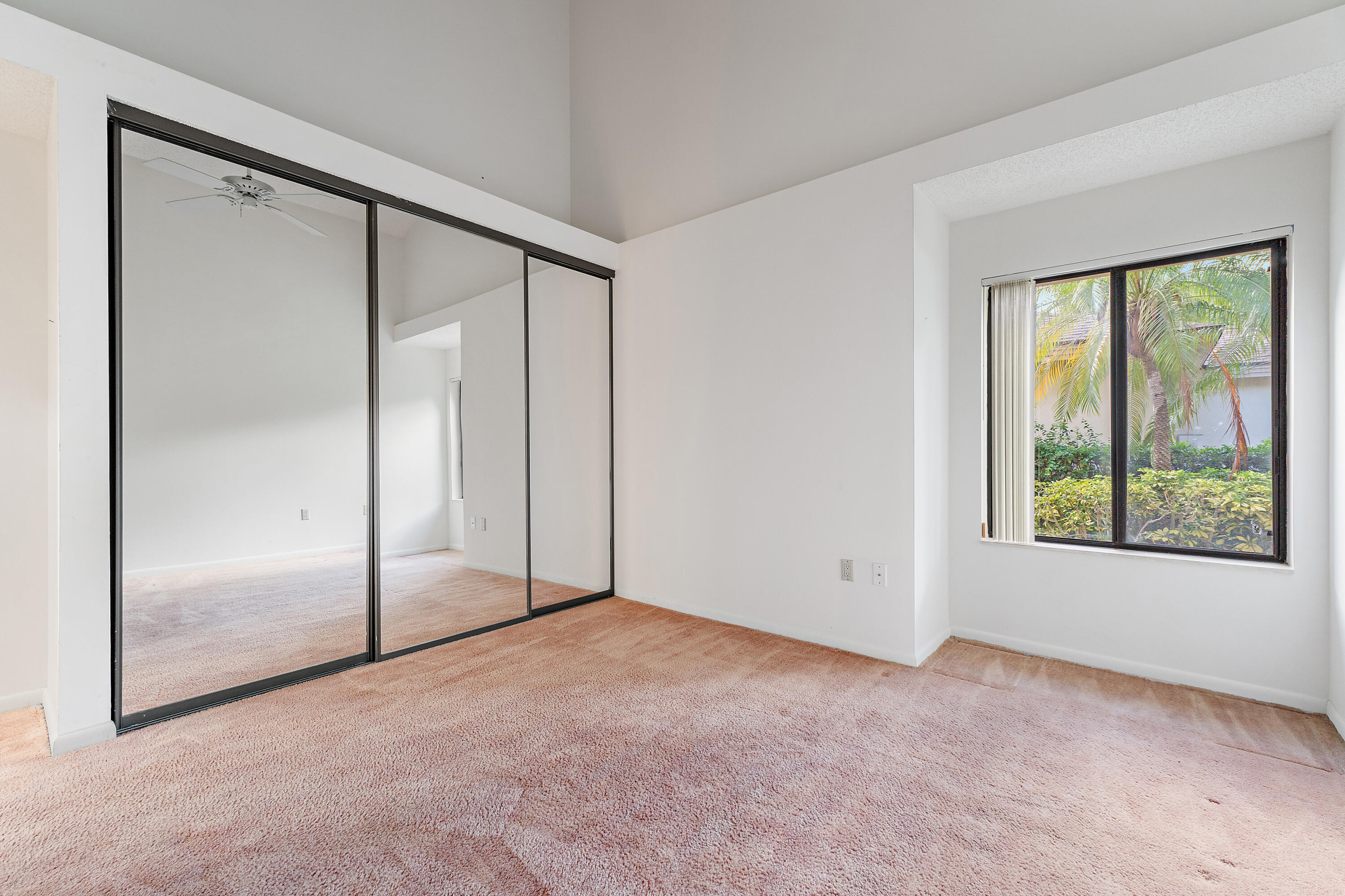 348 River Edge Road Jupiter, FL 33477 - Photo 13 of 30 an empty room with windows and closet