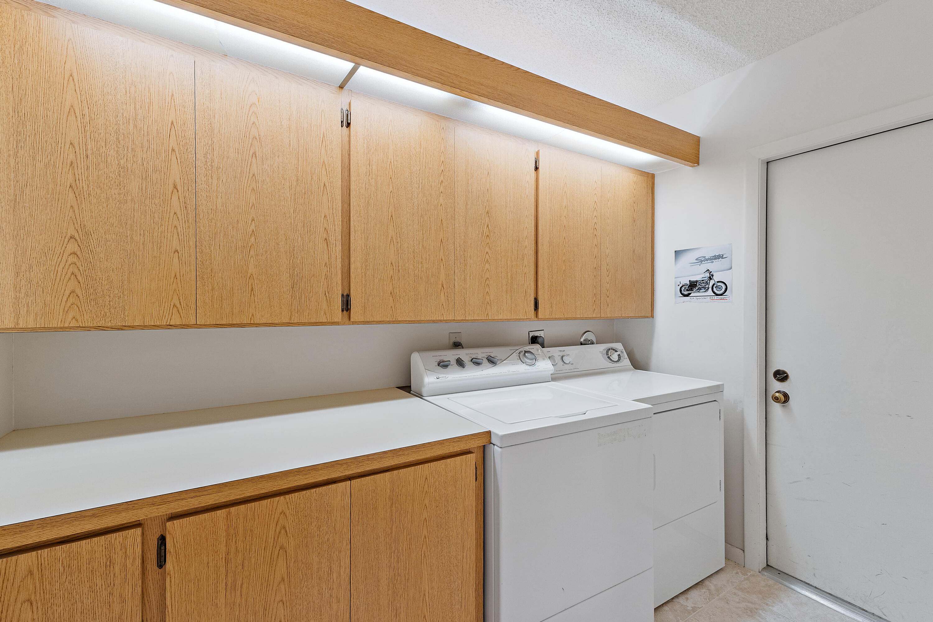 348 River Edge Road Jupiter, FL 33477 - Photo 14 of 30 a bathroom with a sink and a mirror