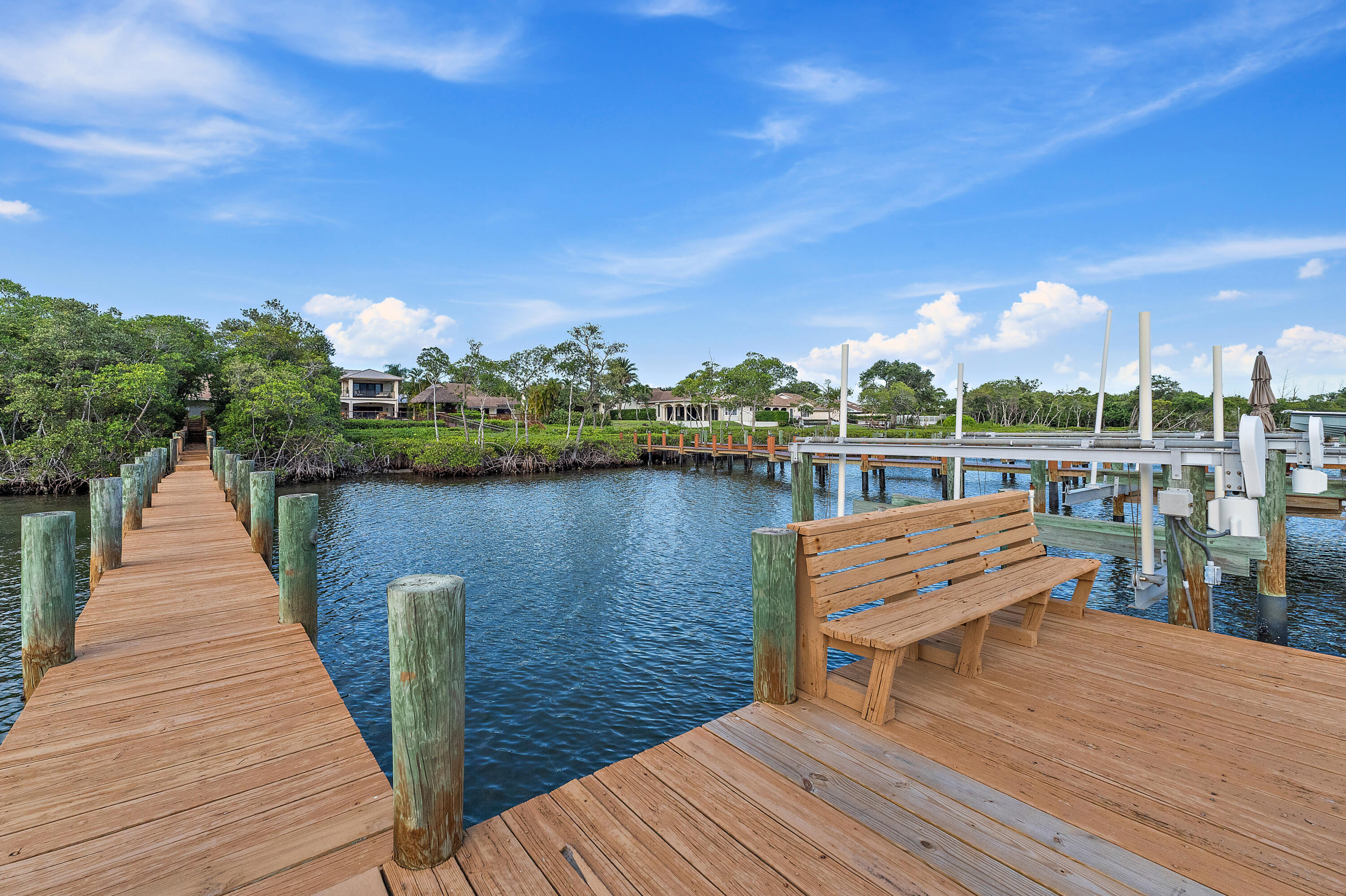 348 River Edge Road Jupiter, FL 33477 - Photo 7 of 30 a view of a lake with sitting area