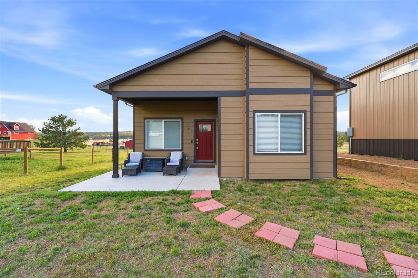 489 Duesouth Road Florissant, CO 80816 - Photo 37 of 40 a backyard of a house with seating space