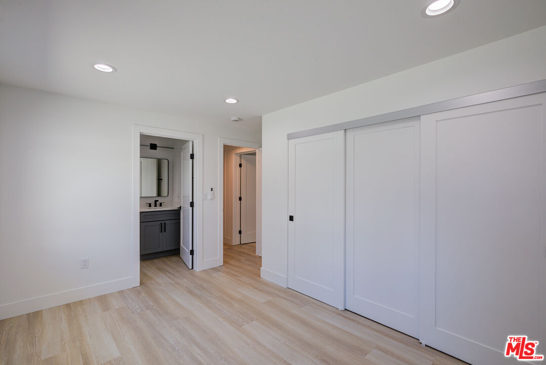 1303 Beryl Street Redondo Beach, CA 90277 - Photo 12 of 31 a view of a hallway with wooden floor and a kitchen