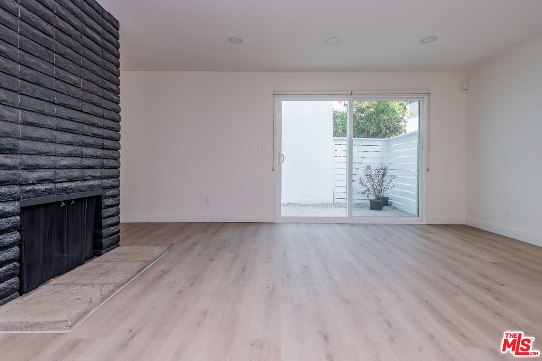 1303 Beryl Street Redondo Beach, CA 90277 - Photo 19 of 31 an empty room with wooden floor and windows