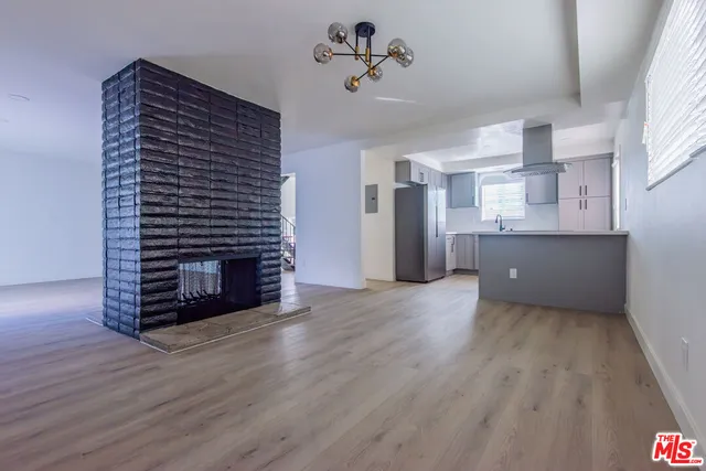 a view of a kitchen with a sink and a stove top oven