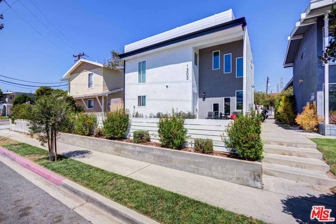 1303 Beryl Street Redondo Beach, CA 90277 - Photo 2 of 31 a front view of a house with garden