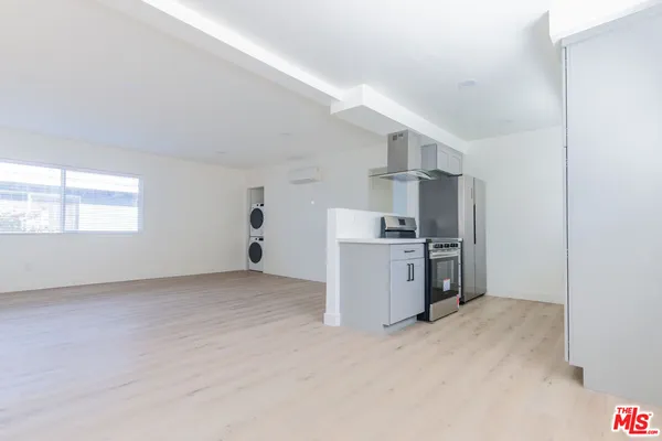 a view of a kitchen with electric appliances