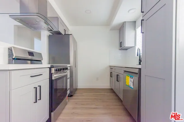 a bathroom with a toilet sink and shower