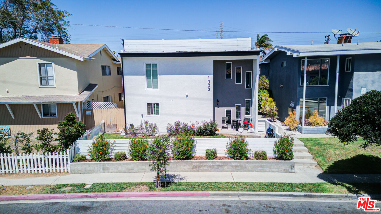 1303 Beryl Street Redondo Beach, CA 90277 - Photo 3 of 31 a front view of a house with a garden and plants
