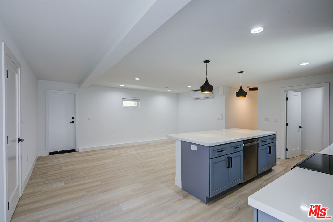 1303 Beryl Street Redondo Beach, CA 90277 - Photo 8 of 31 a kitchen with a stove and a wooden floor