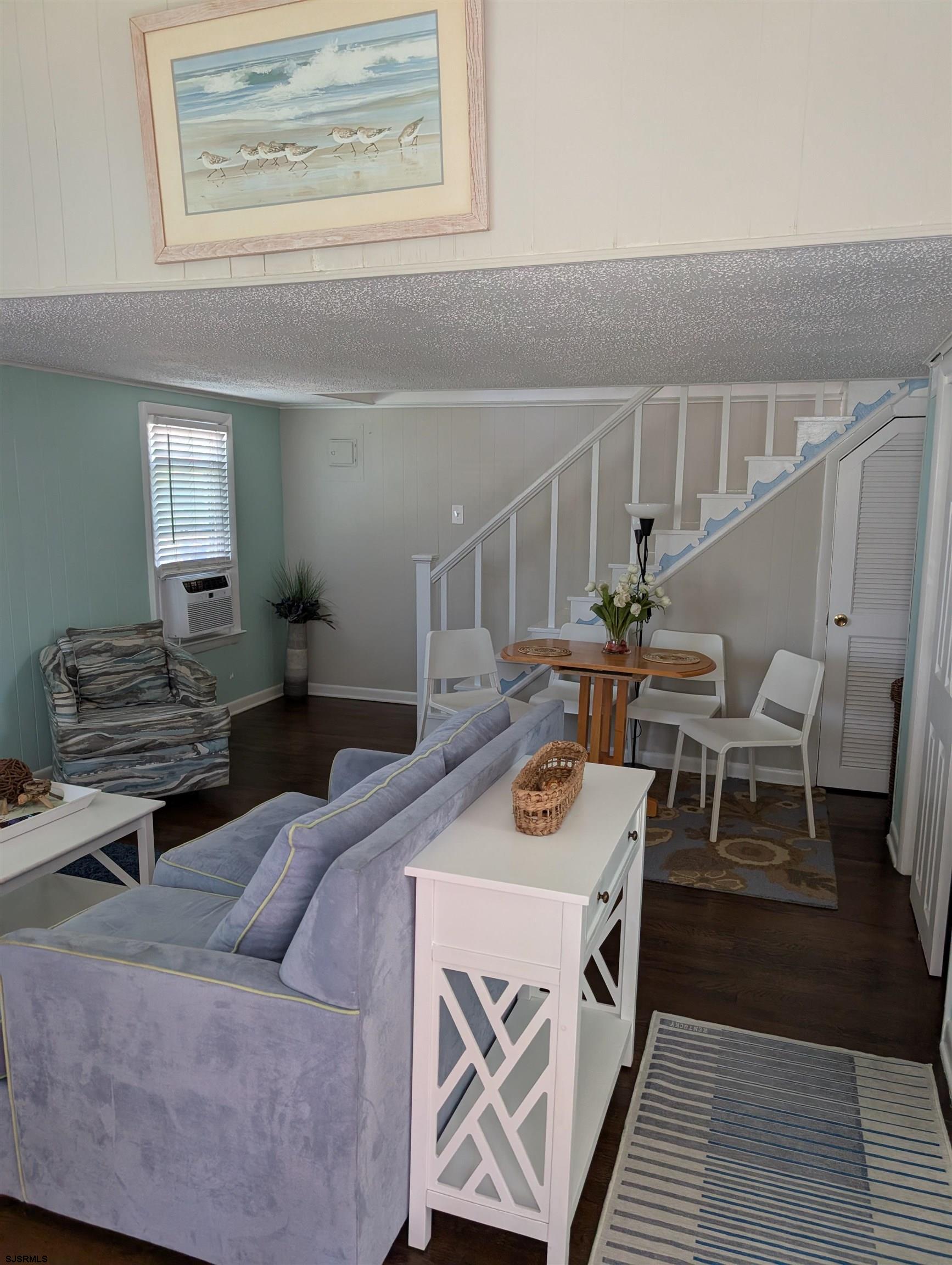 509 East 4th Street, Unit COTTAGE Ocean City, NJ 08226 - Photo 4 of 13 a living room with furniture and wooden floor