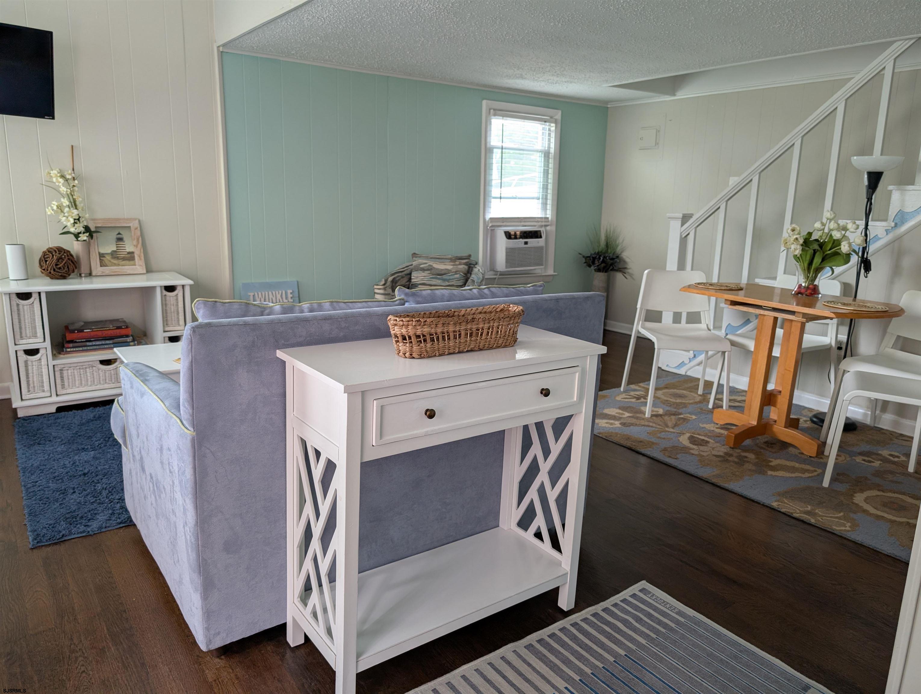 509 East 4th Street, Unit COTTAGE Ocean City, NJ 08226 - Photo 7 of 13 a living room with furniture and a table