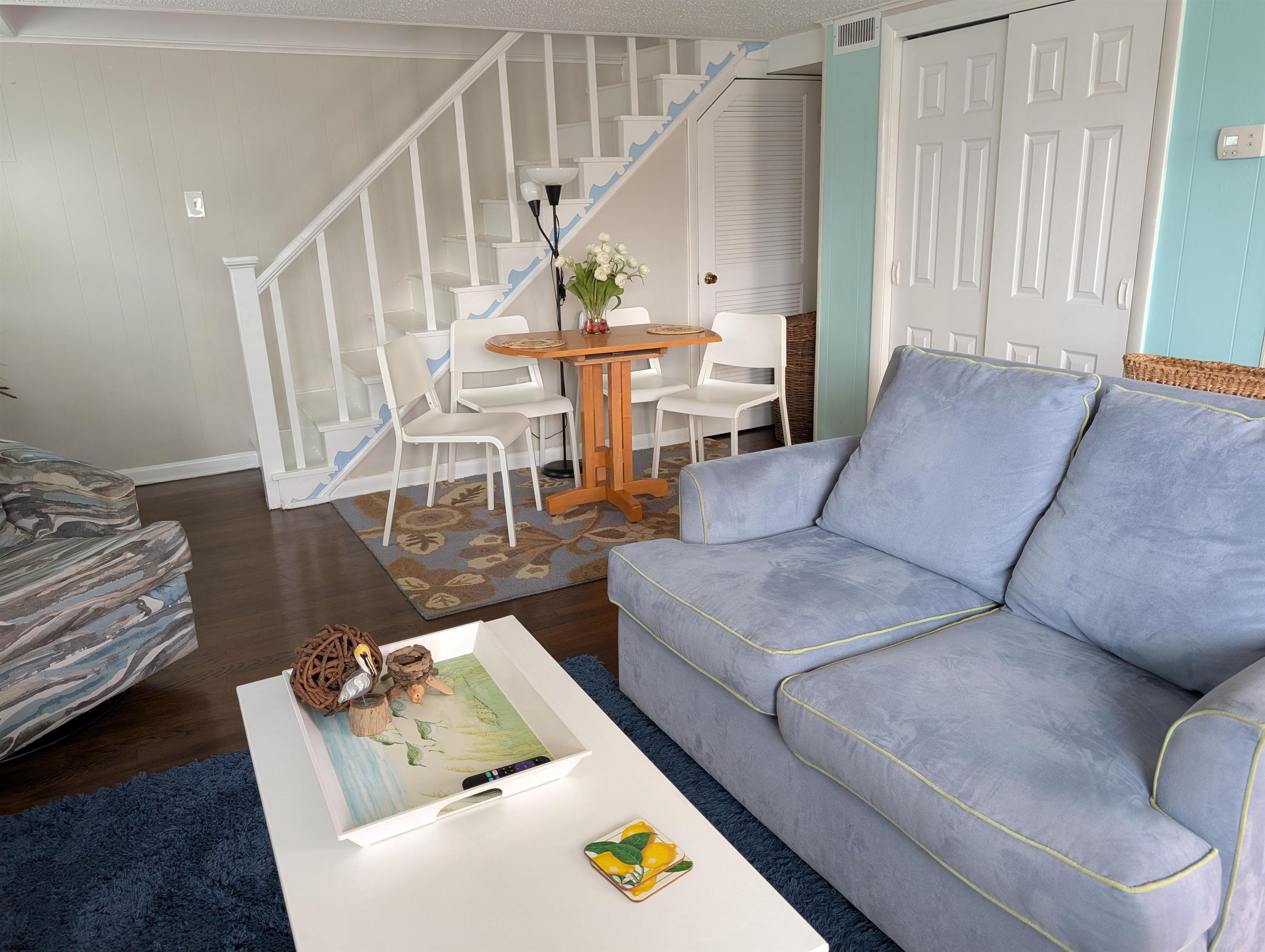 509 East 4th Street, Unit COTTAGE Ocean City, NJ 08226 - Photo 8 of 13 a living room with furniture and wooden floor