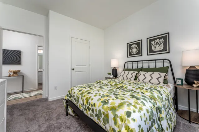 a large bed sitting in a bedroom next to a tv