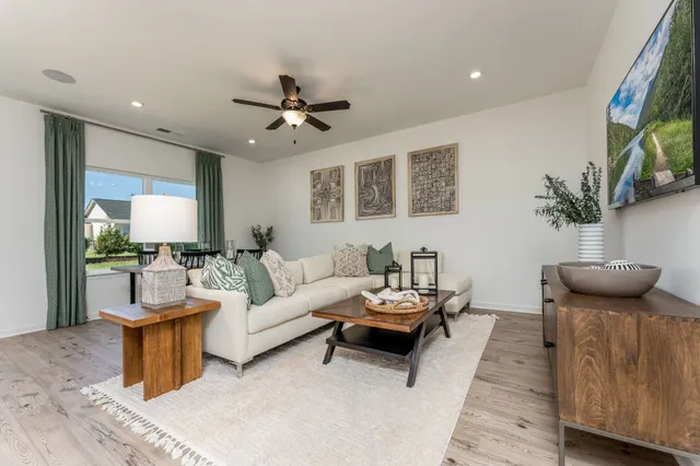 a living room with furniture and a large window
