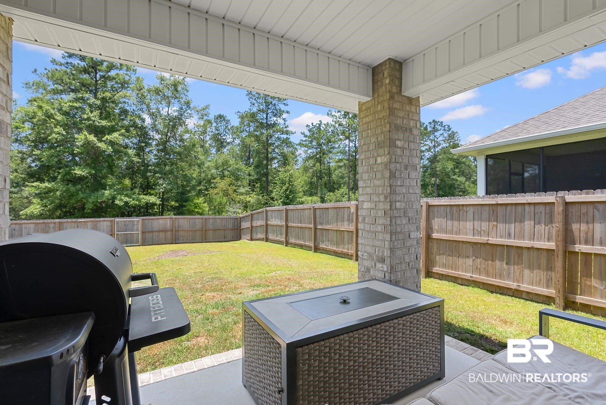 13966 Antler Hl Road Daphne, AL 36527 - Photo 27 of 44 Covered patio with a brick column, concrete flooring, and a beadboard ceiling