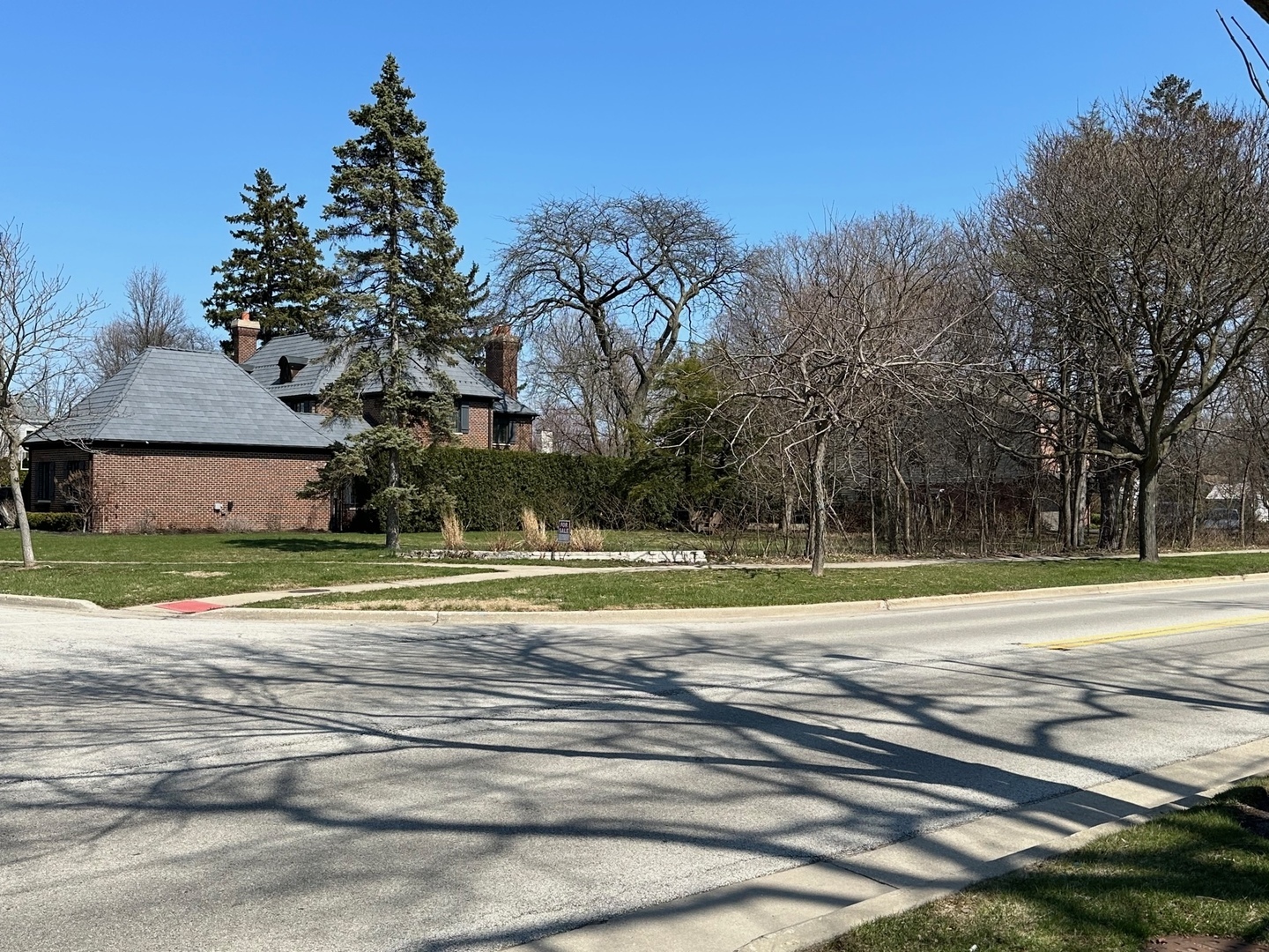 809 Lenox Road Glenview, IL 60025 - Photo 4 of 5 a view of a house with a yard and a large tree