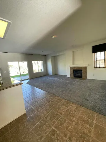 a large kitchen with stainless steel appliances granite countertop a large counter top and stove