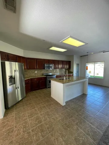 a view of a back yard from a balcony