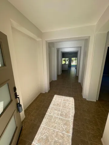a hallway with a rug