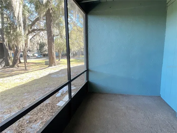 a view of a room with a large window