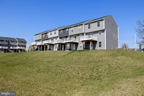 a view of building with yard