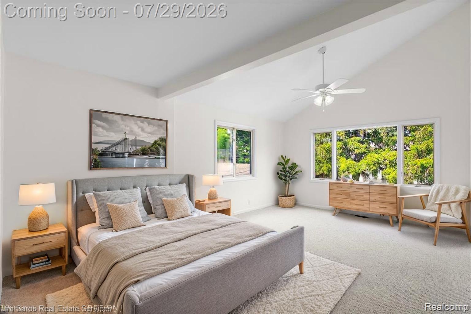 620 Neff Road Grosse Pointe, MI 48230 - Photo 8 of 14 Vaulted ceilings accent this spacious room featuring plush carpeting, a ceiling fan, and large windows offering exterior views