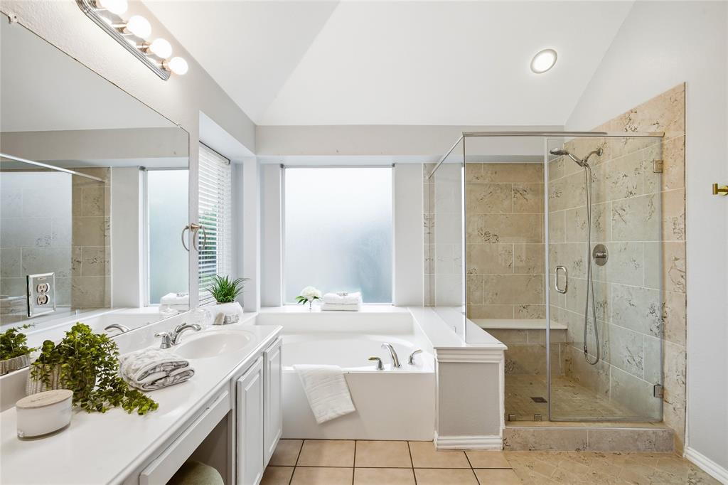 5201 Geode Lane McKinney, TX 75072 - Photo 22 of 37 View of primary bath with garden tub, separate step in shower and double sink vanity.