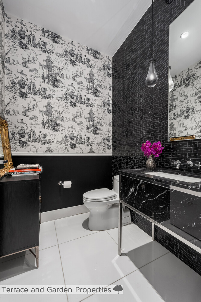 25 Broad Street, Unit PH2D Manhattan, NY 10004 - Photo 10 of 21 a bathroom with a sink toilet and mirror