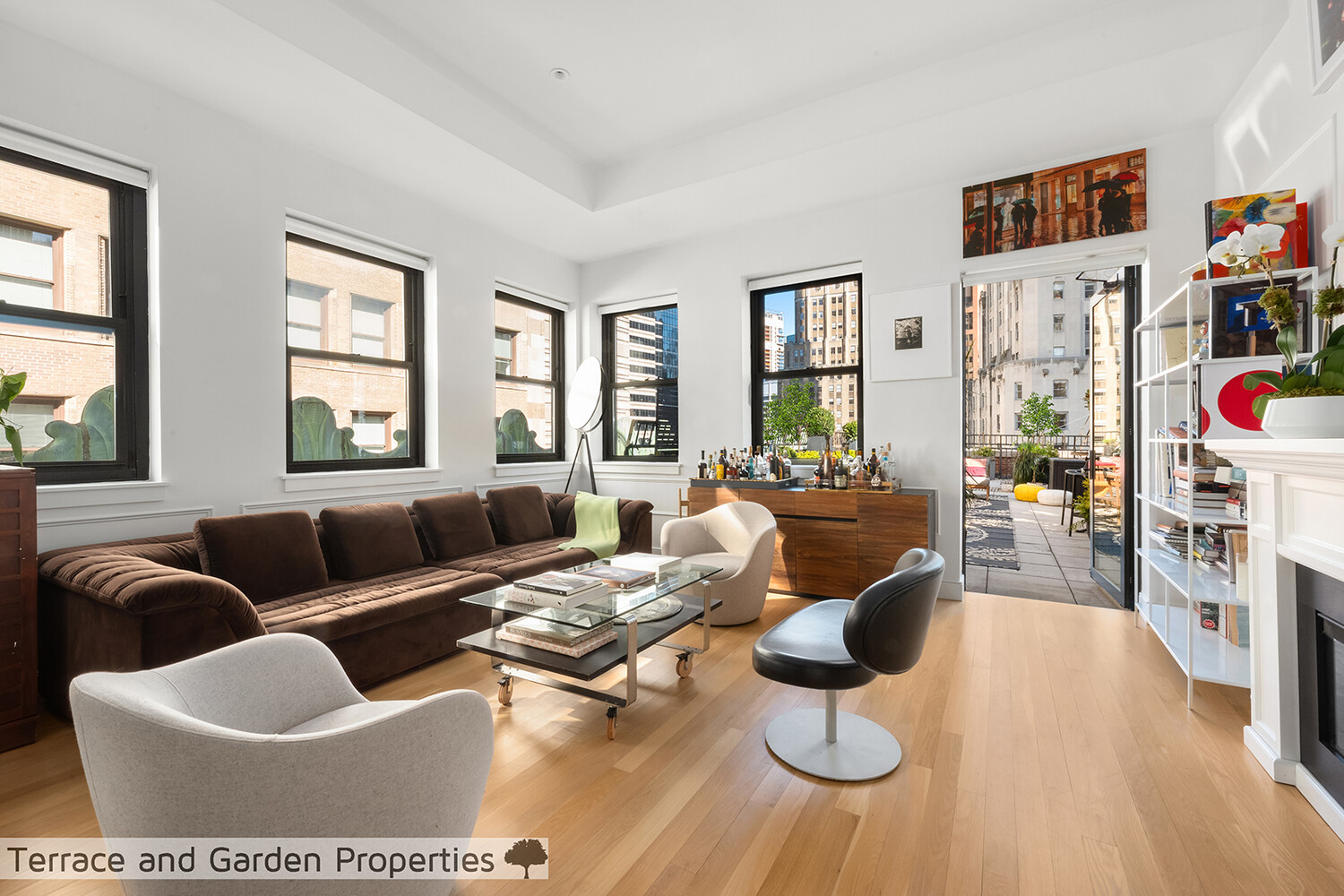 25 Broad Street, Unit PH2D Manhattan, NY 10004 - Photo 2 of 21 a living room with furniture and a floor to ceiling window