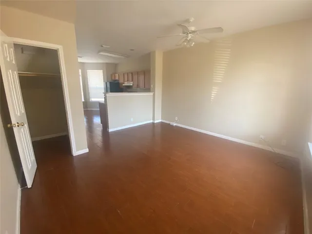 a view of a kitchen with a sink and a kitchen view