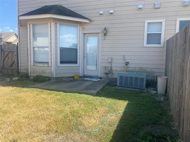 a view of backyard with tub